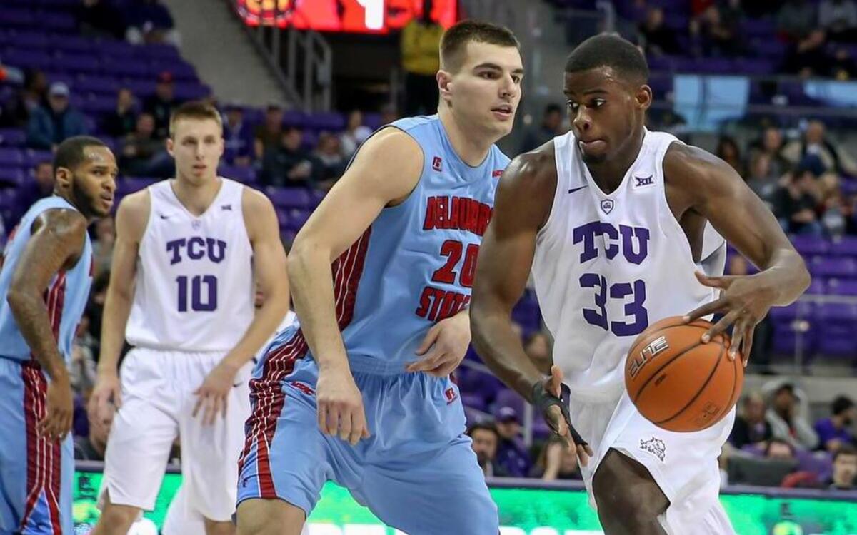 TCU forward Chris Washburn, right, returned from a broken finger to score five points in 25 minutes Monday against Delaware State and Mrdjan Gasevic.