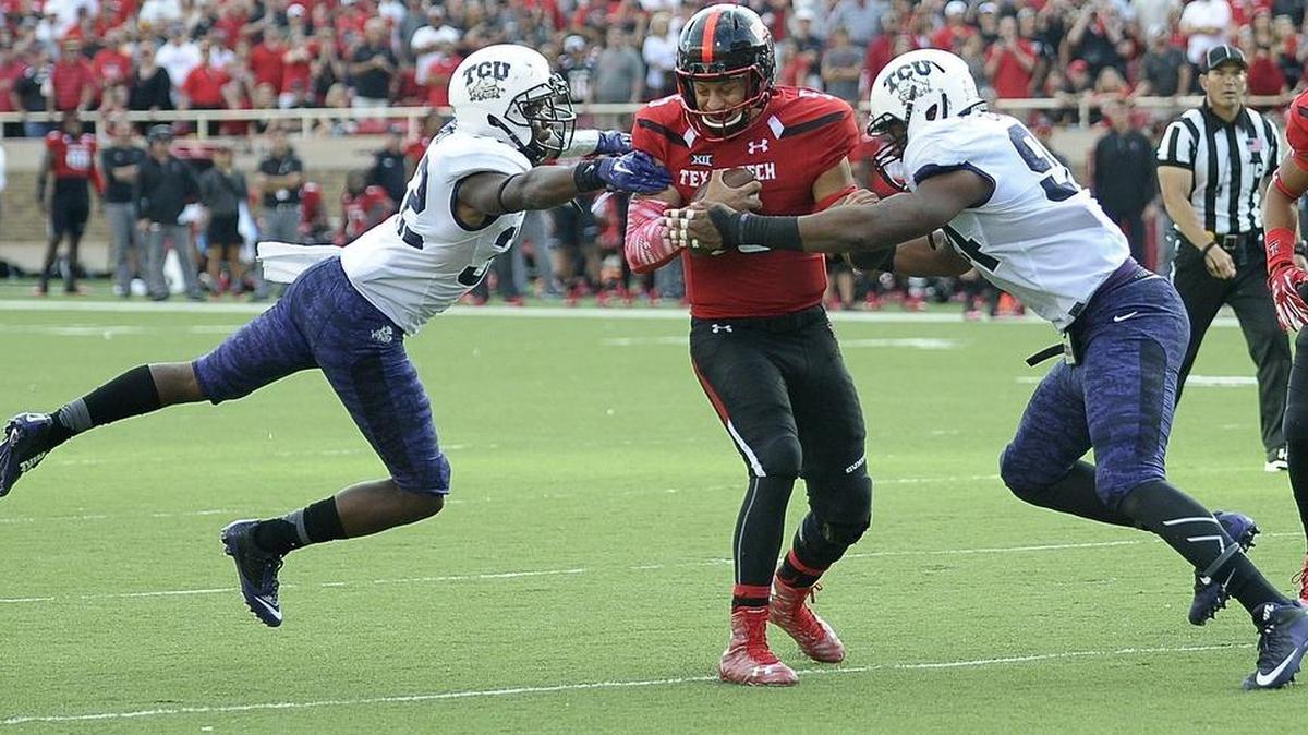 TCU safety Travin Howard (left) and defensive end Josh Carraway close in on Texas Tech quarterback Patrick Mahomes in a 2015 game in Lubbock. The return of Howard and Carraway is among the reasons TCU is recognized in some preseason Top 25 rankings.