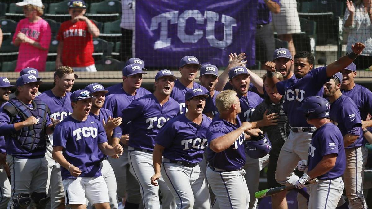 Luken Baker, holding his batting helmet, prepares to celebrate with his teammates at the plate after hitting a solo home run in the 10th inning of TCU’s 11-10 victory against West Virginia in the Big 12 tournament championship game Sunday. It was his fourth home run of the tournament.