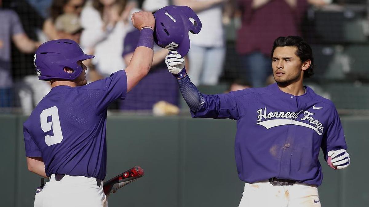 TCU hitter Elliott Barzilli (right) gets congratulations from teammate Evan Skoug after homering in the fifth inning Saturday against Penn State. It was the Horned Frogs’ first home run of the season.