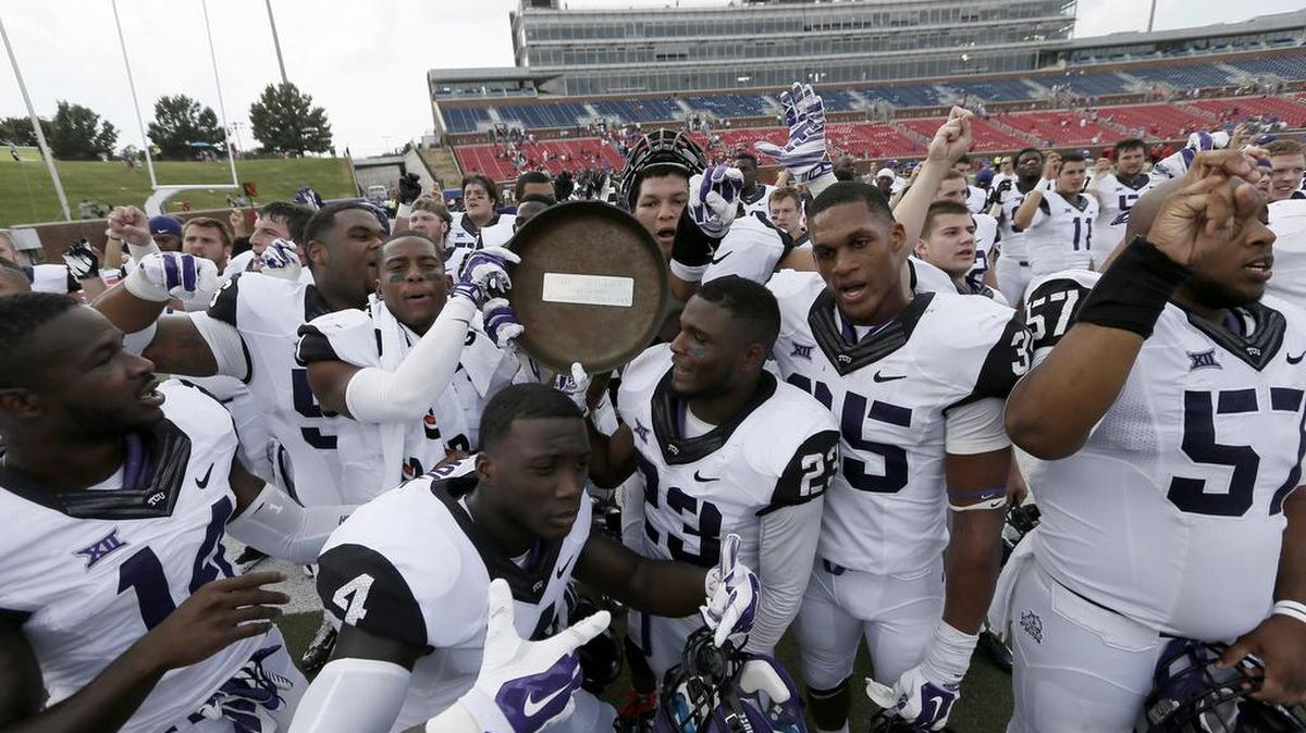 The Horned Frogs celebrate their 56-0 win over SMU in 2014. TCU has won four straight games against SMU.