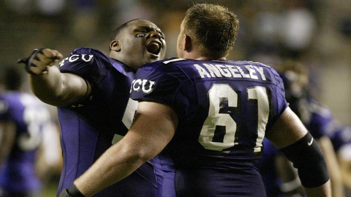 TCU defensive lineman Zarnell Fitch celebrates with teammate Ben Angeley after an overtime victory against Utah on Sept. 15, 2005, at Amon Carter Stadium.