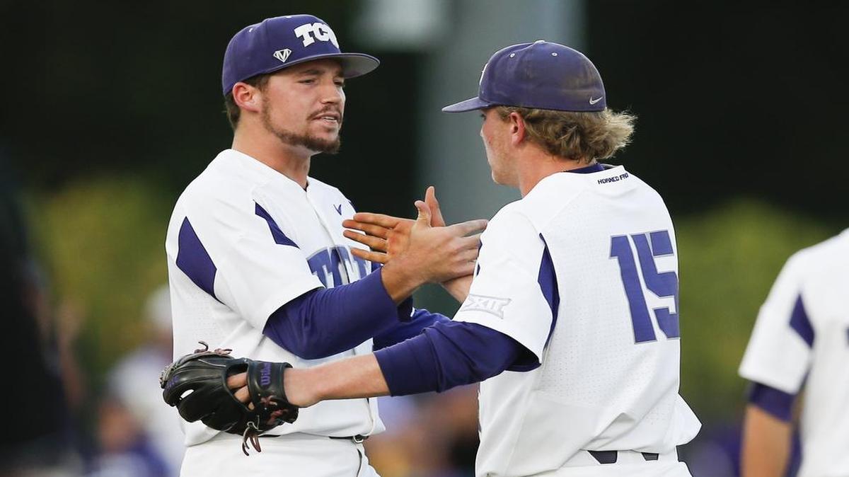 TCU pitchers Jared Janczak (left) and Durbin Feltman share congratulations after the final out of Game 1 in the Super Regional series against Missouri State. Feltman recorded his school single-season record 17th save in closing the 3-2 victory Saturday at Lupton Stadium.
