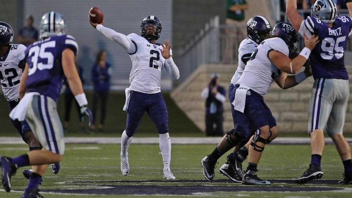 
TCU quarterback Trevone Boykin releases a long throw during the first quarter of the game against Kansas State. He threw two touchdown passes and ran for two touchdowns, leading the Horned Frogs to a 52-45 comeback victory, and won the Big 12 offensive player of the week award.
