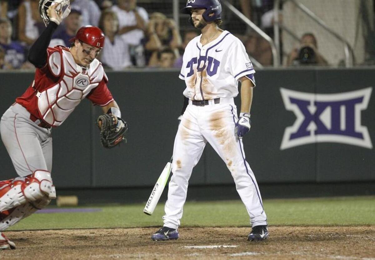 
N.C. State catcher Andrew Knizner reacts to the called third strike against TCU hitter Garrett Crain to end the game Saturday night. The Wolfpack’s 5-4 victory sent the Horned Frogs to the elimination bracket in the Fort Worth Regional at Lupton Stadium.
