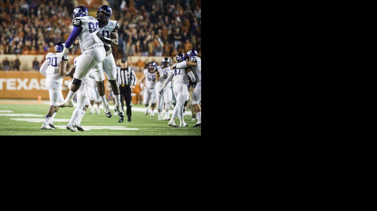 
TCU’s Chucky Hunter (96) and James McFarland celebrate a touchdown during the Horned Frogs’ victory against Texas. (AP Photo/Ashley Landis)
