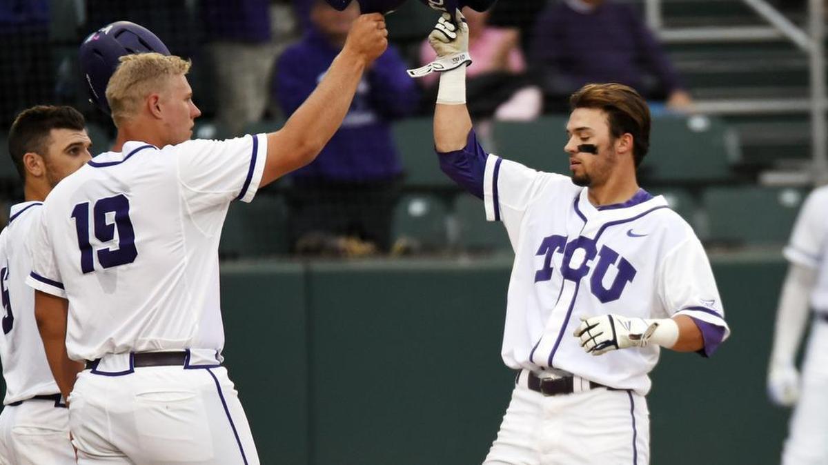 TCU hitter Dane Steinhagen gets congratulations at home plate after his two-run home run in the second inning of Tuesday’s 3-2 victory against Stephen F. Austin. It tied him for the team lead in RBIs.