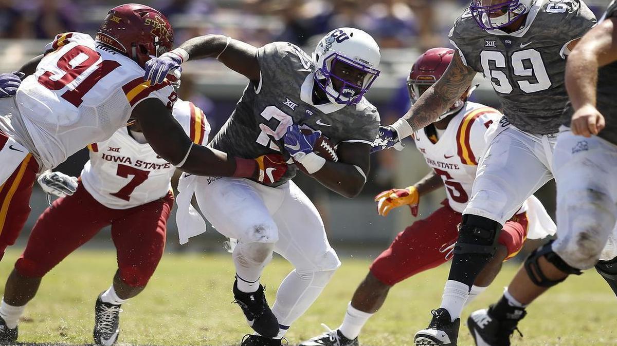TCU running back Derrick Green moves through an opening against Iowa State. The graduate transfer from Michigan scored his first TCU touchdown in the Horned Frogs’ 41-20 victory last week at Amon G. Carter Stadium.