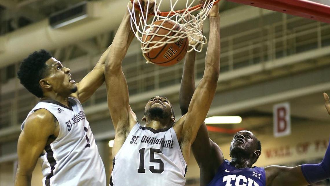 St. Bonaventure’s Idris Taqqee, left, and LaDarien Griffen, center, jam the ball into the basket as TCU’s Kouat Noi, right, tries to defend in Saturday’s championship game of the Emerald Coast Classic.