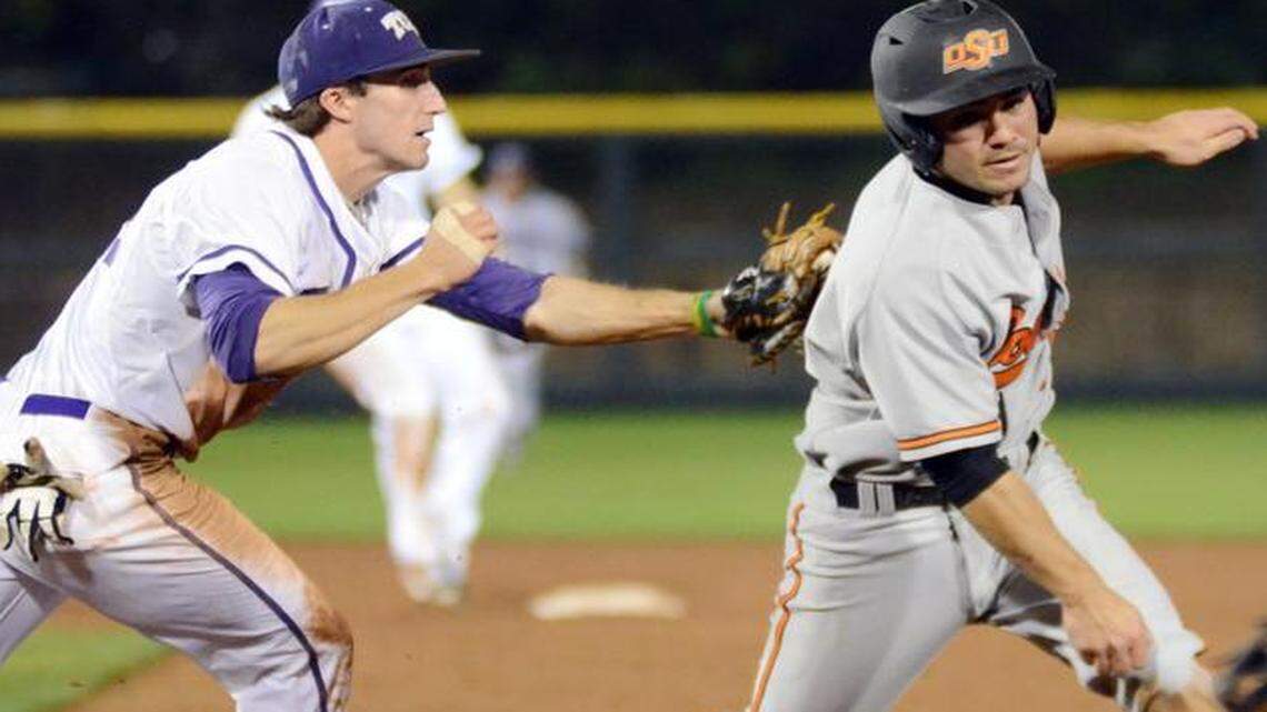
TCU first baseman Jeremie Fagnan, left, tags Oklahoma State’s Tim Arakawa in an 11th-inning rundown. 
