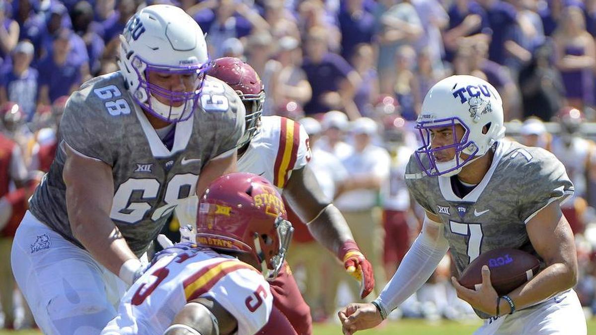 TCU tackle Joseph Noteboom, left, blocks for quarterback Kenny Hill, right, during a touchdown run against Iowa State in 2016.
