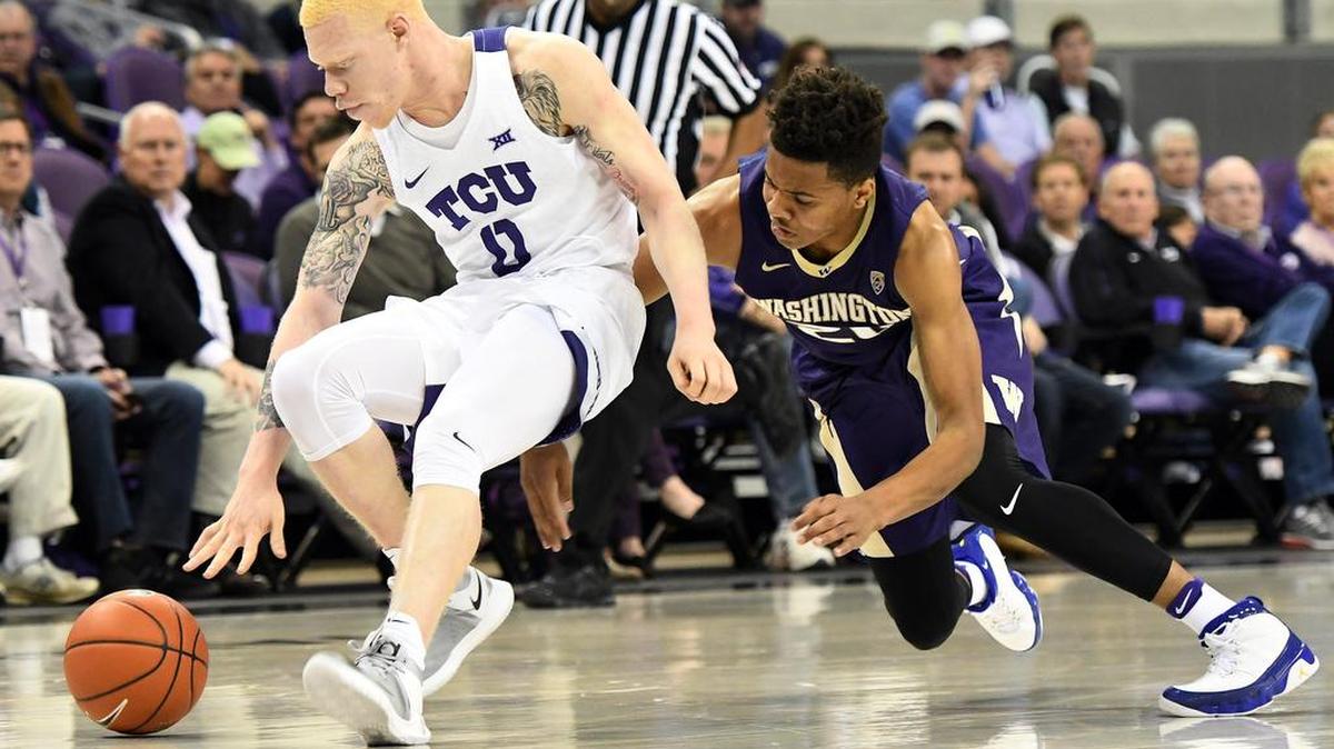 TCU points guard Jalen Fisher corrals a loose ball in Wednesday’s game against Washington.