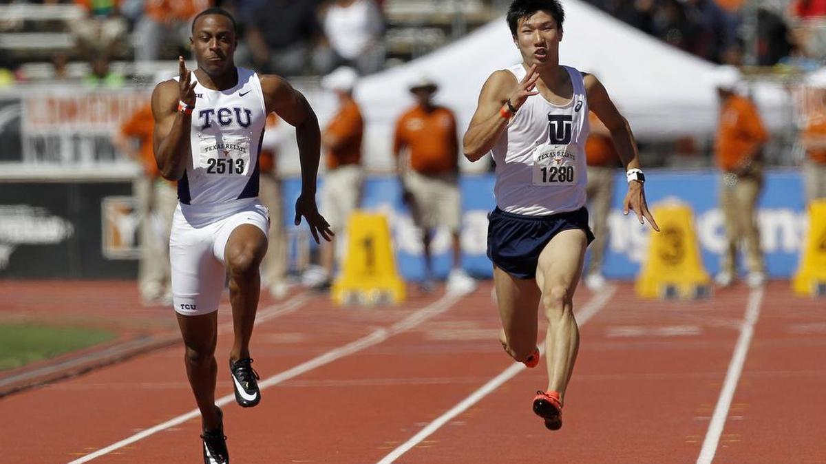 TCU’s Ronnie Baker, left, runs next to Yoshihide Kiryu of Japan in the 100-meter Invitational at the Texas Relays.
