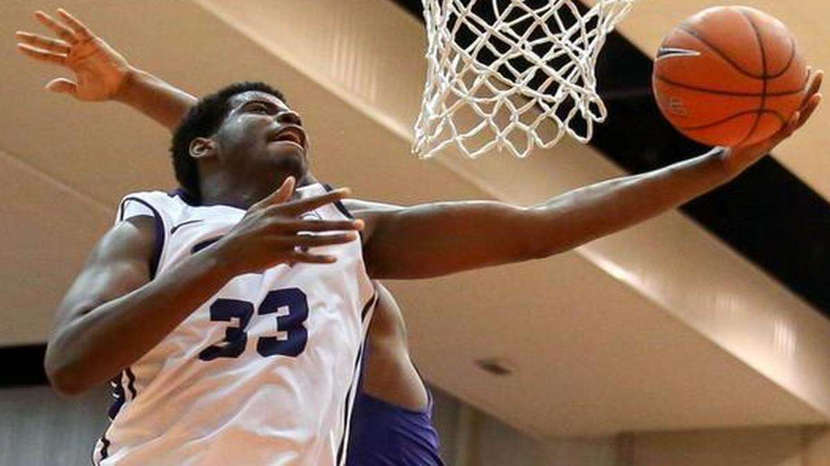 
TCU forward Chris Washburn goes in for two of his game-high 17 points against Kansas State. 
