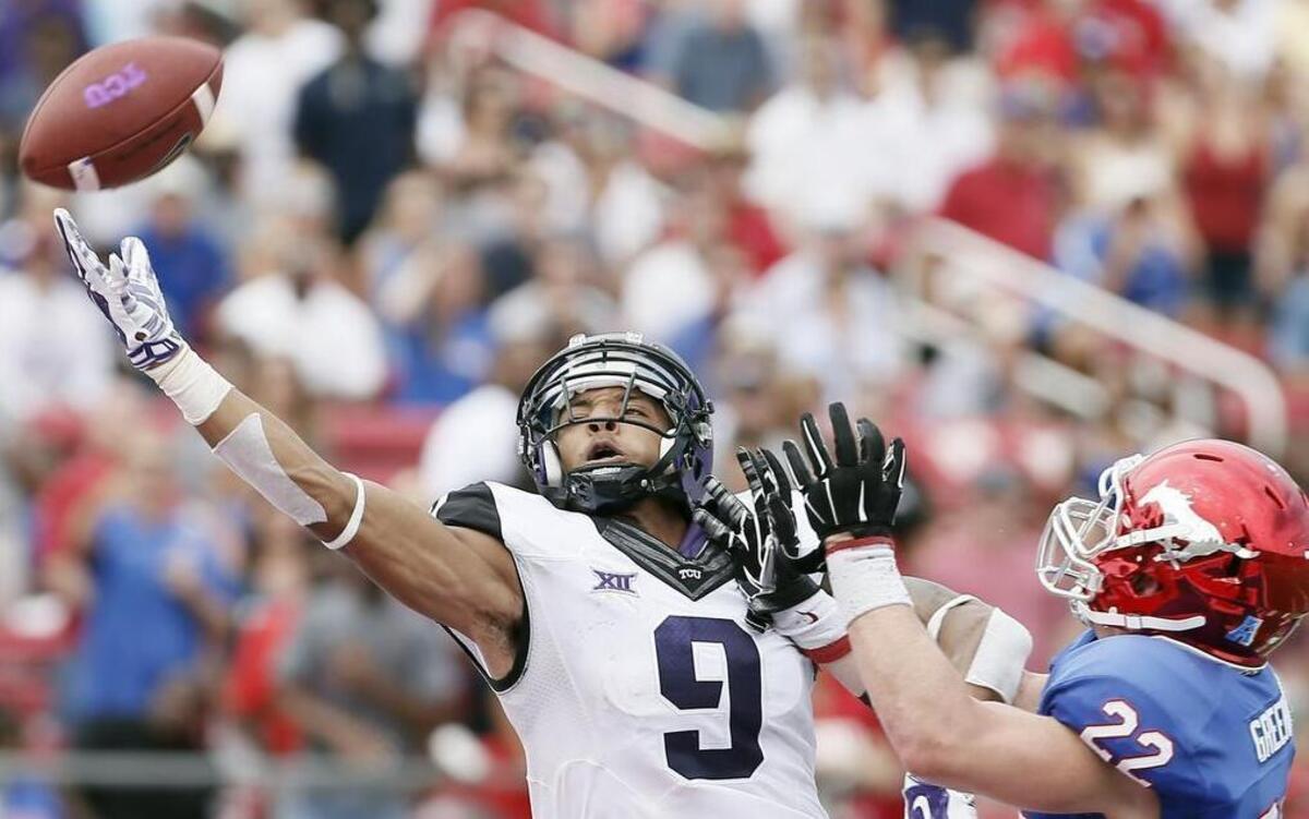 
TCU’s Josh Doctson stretches for a pass in the end zone against SMU’s Hayden Greenbauer in last year’s game. The ball was out of reach, but Doctson finished with five catches and a touchdown.
