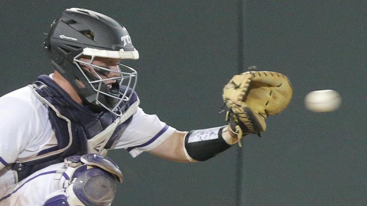 
TCU catcher Evan Skoug (9) catches in the eighth inning as TCU defeats Texas A&M 5-4 in 16 innings in the NCAA Division 1 Baseball Super Regional final in Lupton Stadium, Monday, June 8, 2015. 

