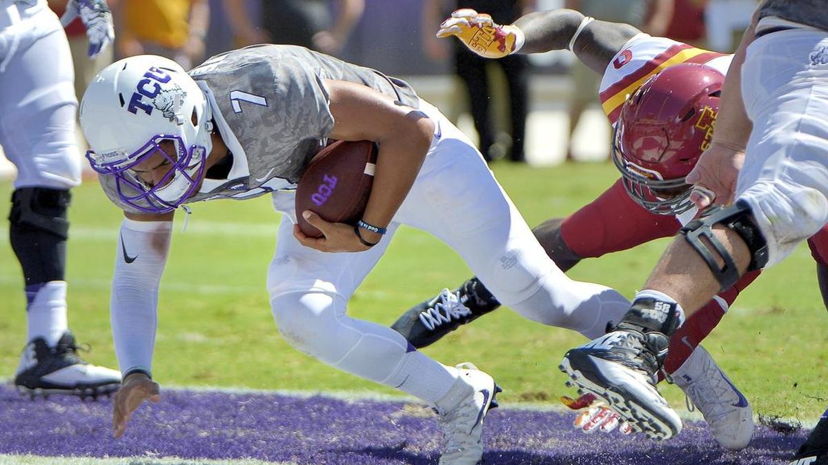 TCU quarterback Kenny Hill falls falls into the end zone on a 1-yard touchdown run in the second quarter. It was his team-leading sixth rushing score.