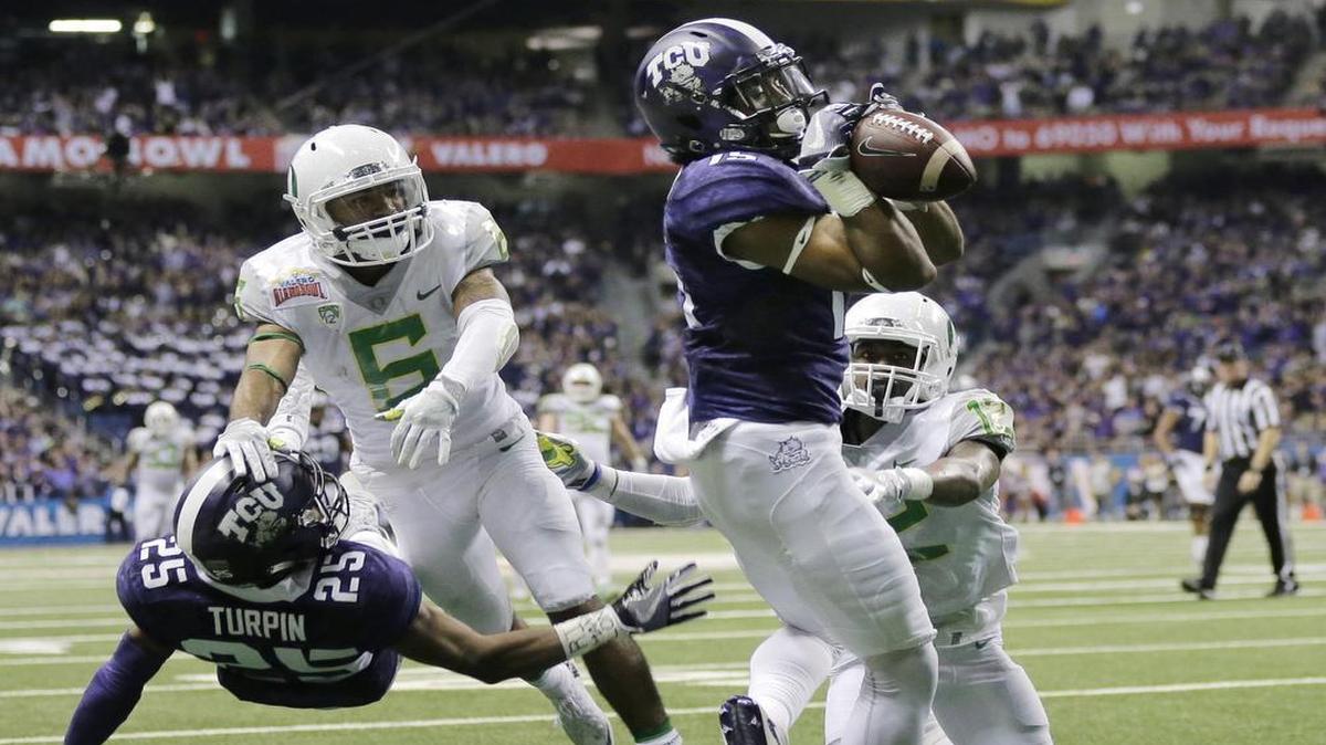 TCU receiver Jaelan Austin secures a touchdown catch in the third quarter of the Alamo Bowl against Oregon. The score started TCU’s bowl record-tying comeback in a 47-41 triple-overtime victory on Jan. 2 in San Antonio.