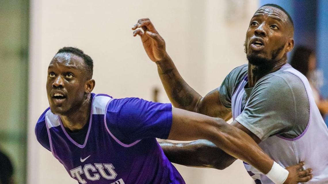 TCU’s Kouat Noi (left) boxes out teammate JD Miller during a July workout on campus.