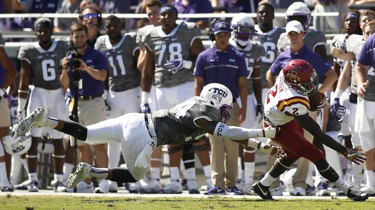 TCU defensive end Josh Carraway makes a diving attempt at a tackle of Iowa State running back Mike Warren during a Sept. 17 game at Amon G. Carter Stadium.