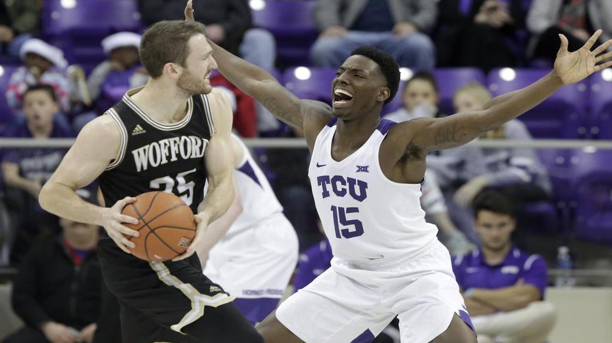 TCU forward J.D. Miller closes in to guard Wofford forward Ryan Sawvell during a Dec. 10 game at Schollmaier Arena.