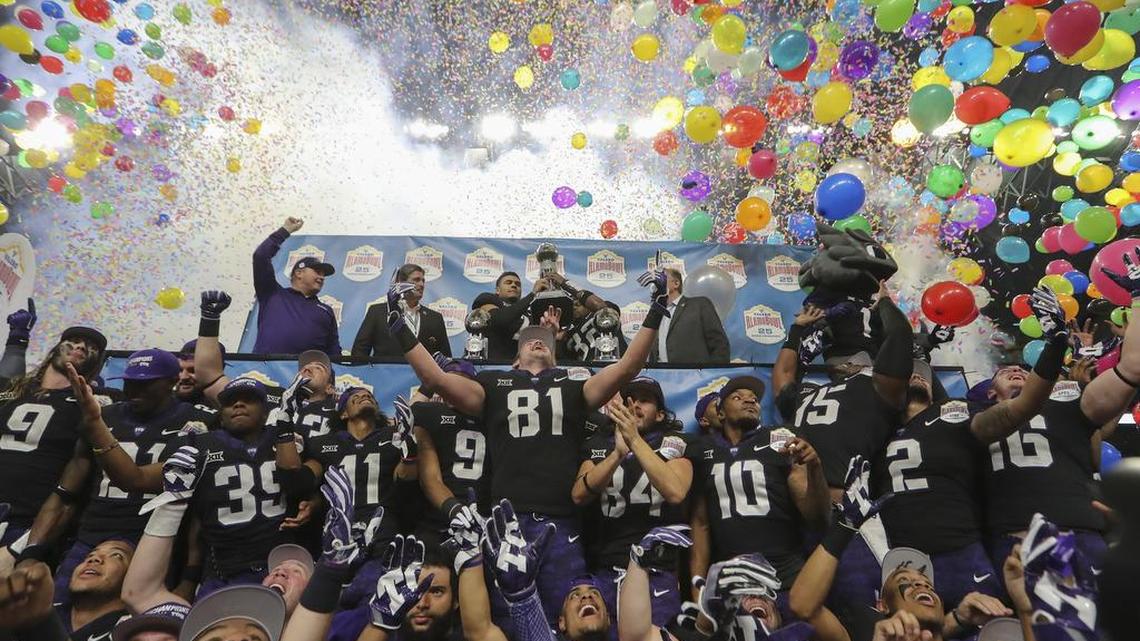 TCU players and coaches celebrate on-stage at the Alamodome in San Antonio following a 39-37 victory against Stanford in the Alamo Bowl on Dec. 28, their second victory in the game in three years.