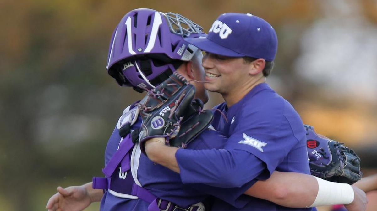 TCU pitcher Jared Janczak gets congratulations from catcher Evan Skoug after being removed in the ninth inning from a March 18 game against Kansas. Janczak allowed no hits in the first eight innings.