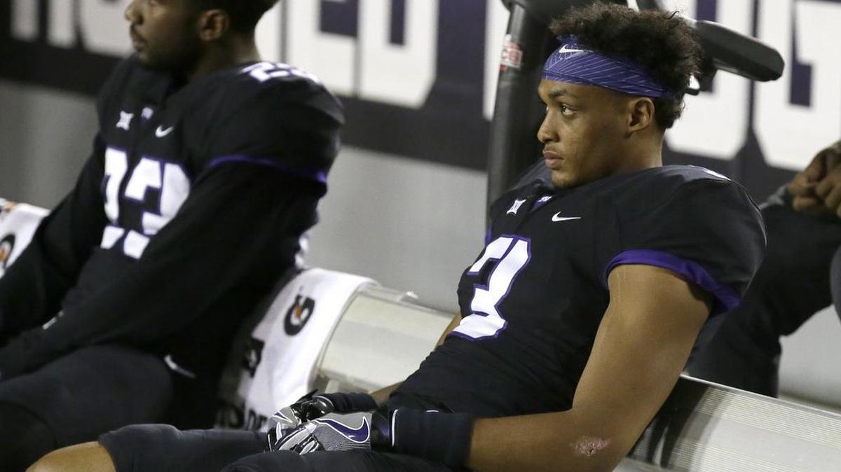 TCU reserve safety Markell Simmons (right) and reserve linebacker Alec Dunham watch the final minute of the fourth quarter in last week’s 52-46 loss to Oklahoma.