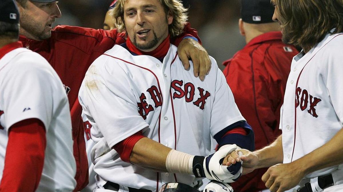 Kevin Millar, center, played for four Major League Baseball teams in an 11-year career, winning a World Series with the Boston Red Sox in 2004. He now serves as an analyst on MLB Network.