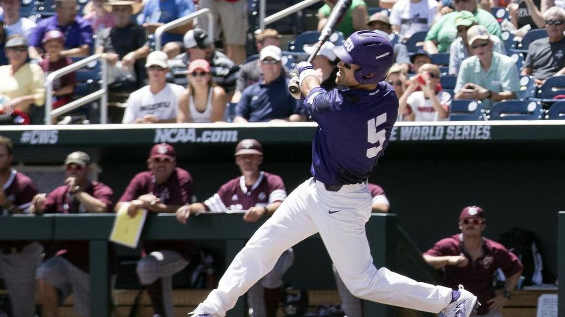 TCU’s Ryan Merrill follows through on a home run swing in the third inning Tuesday against Texas A&M at the College World Series.