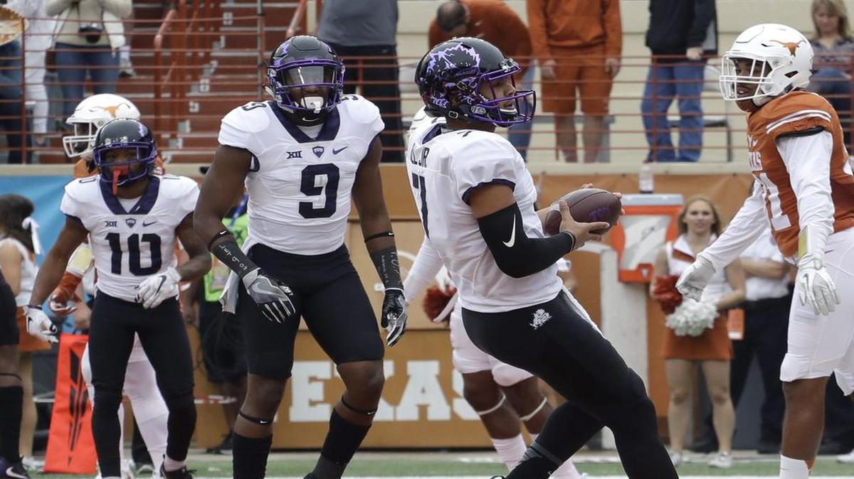 TCU quarterback Kenny Hill pulls up in the end zone after a first-quarter touchdown run, with teammates John Diarse (9) and Desmon White ready to congratulate him. Hill ran for 78 yards in the 31-9 victory, which made TCU bowl-eligible.