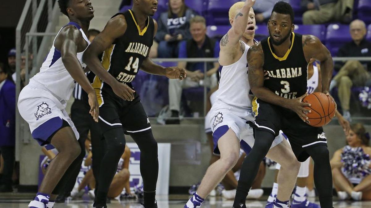 Alabama State Hornets guard Torloft Thomas (3) is pressured by TCU Horned Frogs guard Jaylen Fisher (0) in the first half. Alabama State men play TCU in Fort Worth, Monday, November 14, 2016.