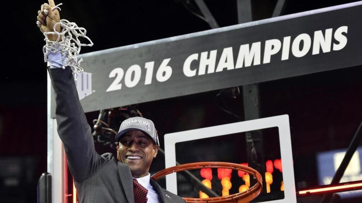 Fresno State coach Rodney Terry, a potential candidate at TCU, celebrates Saturday’s victory in the Mountain West Conference men's tournament that sealed an NCAA bid. (AP Photo/David Becker)