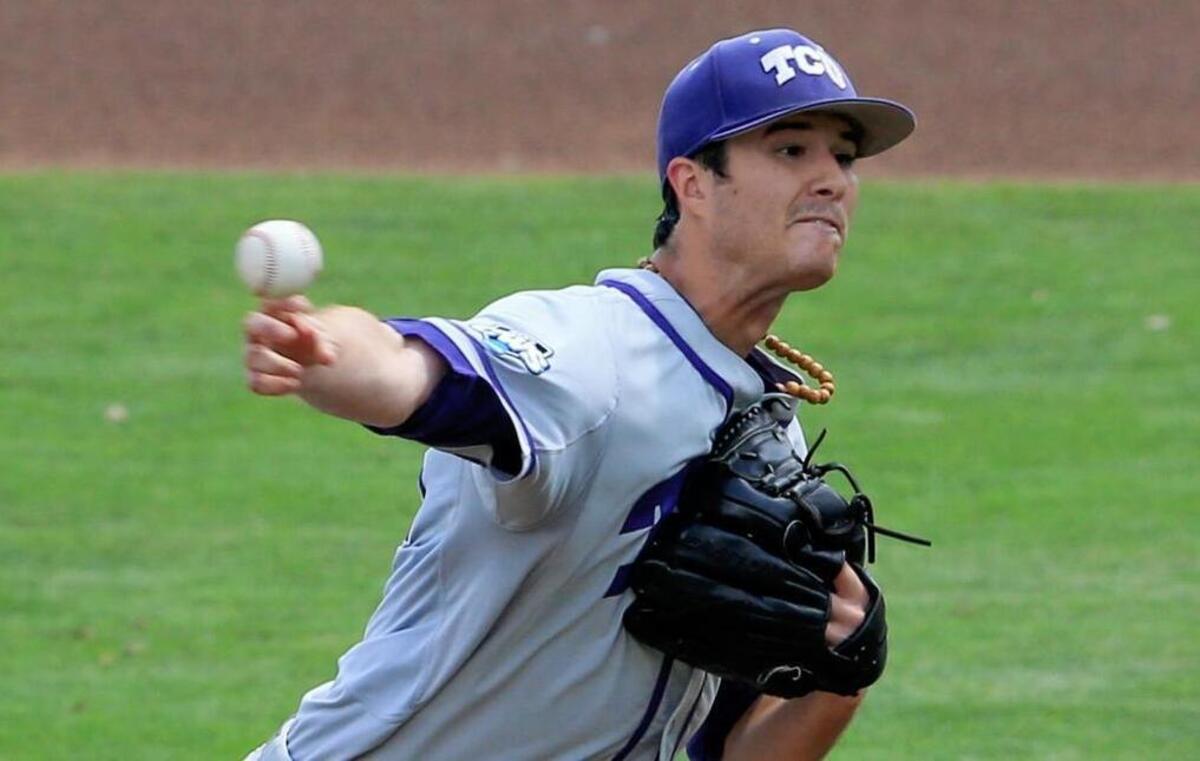 
TCU senior Preston Morrison throws a first-inning pitch Sunday against LSU at the College World Series. Morrison went seven innings, allowing a run on five hits in the Horned Frogs’ 10-3 victory.
