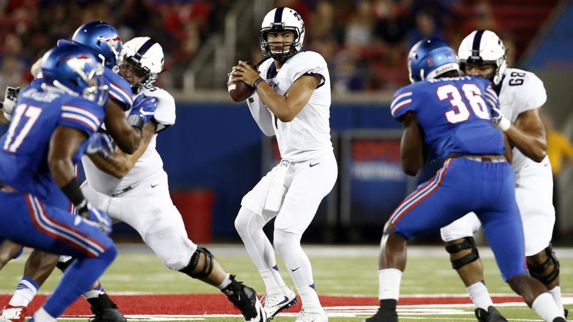 TCU quarterback Kenny Hill looks to pass during last year’s game at SMU. He threw for 452 yards and two touchdowns in the Horned Frogs’ 33-3 victory.