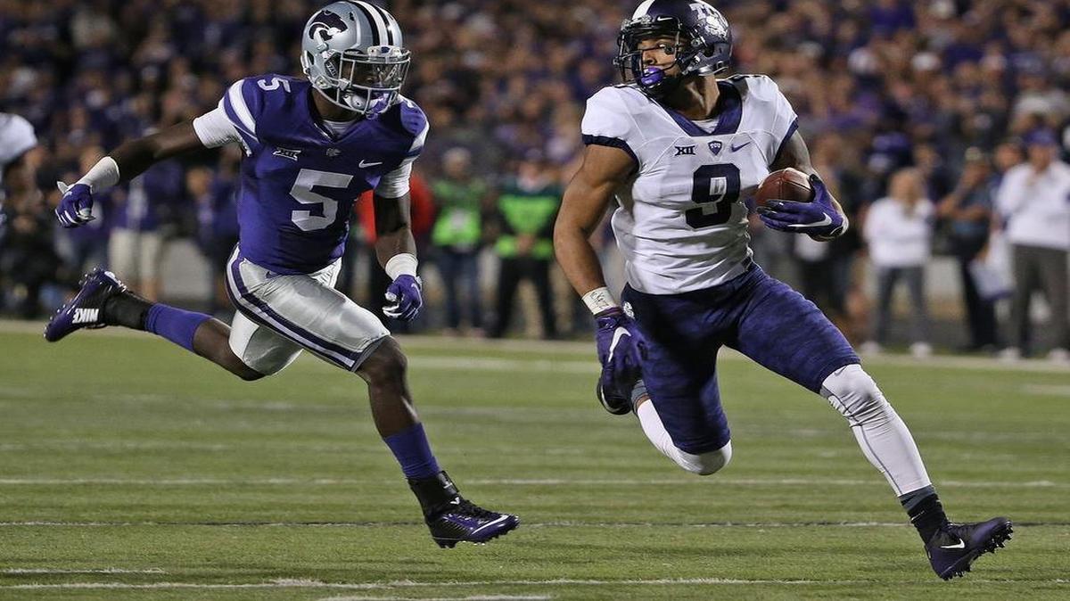 
TCU receiver Josh Doctson makes a move to the end zone to finish a 55-yard scoring catch. It was the game-winning score for the Horned Frogs in the 52-45 victory against Kansas State, just the second play of the drive.
