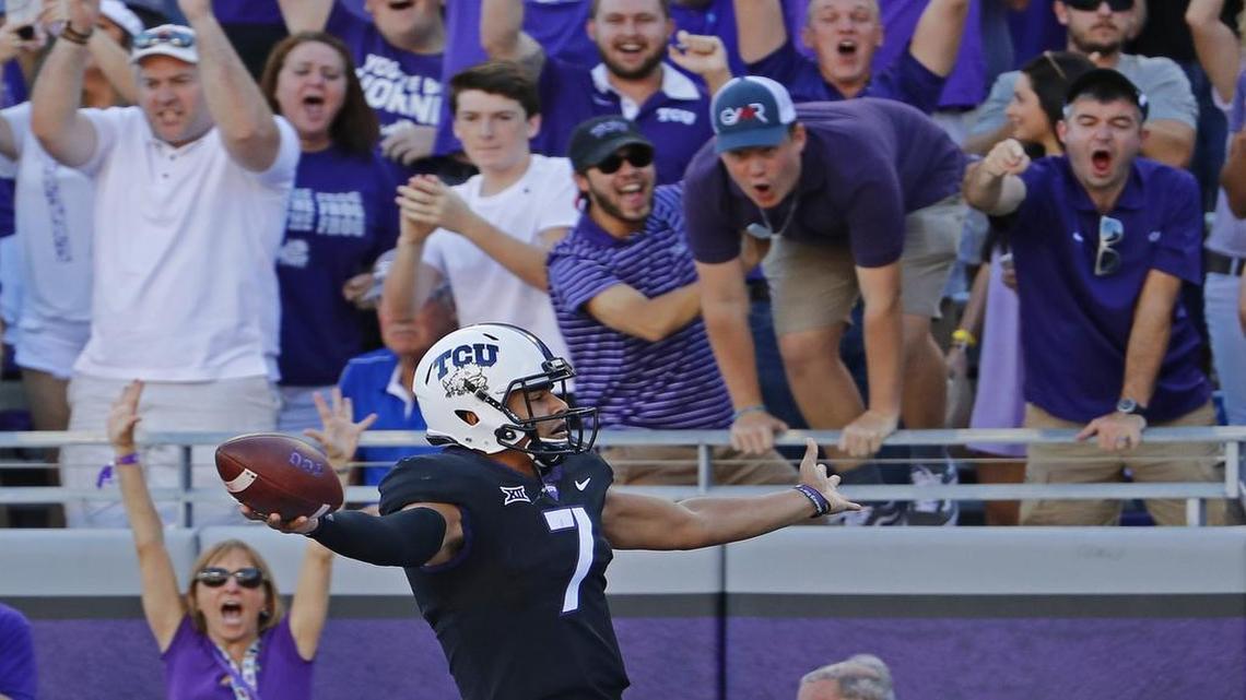 TCU Horned Frogs quarterback Kenny Hill scores a third quarter touchdown during the Horned Frogs’ 31-24 win over West Virginia Saturday at Amon G. Carter Stadium.