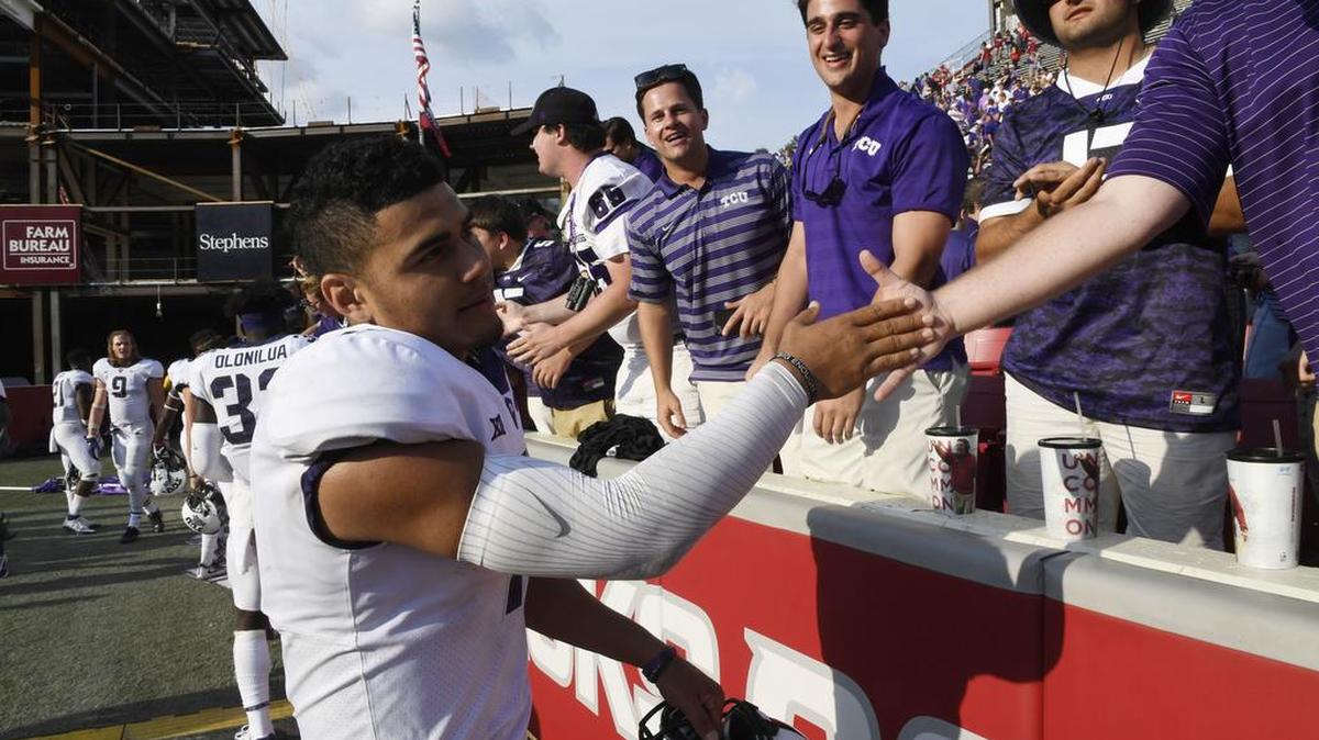 TCU quarterback Kenny Hill greets fans following a 28-7 win against Arkansas at Reynolds Razorback Stadium in Fayetteville on Saturday, Sept. 9.