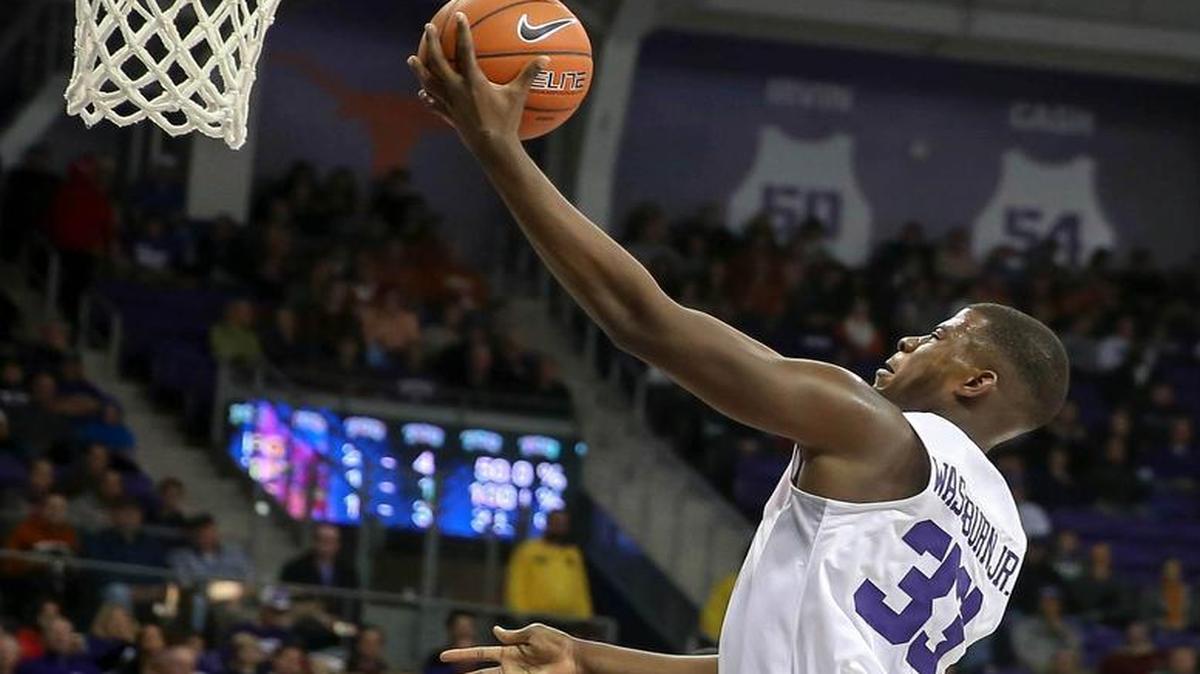 TCU forward Chris Washburn drives in for two of his 14 points Saturday against Texas.