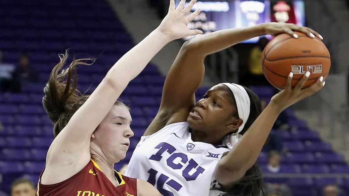 TCU guard Jada Butts (15) battles for position in the lane against Iowa State guard Bridget Carleton (21).