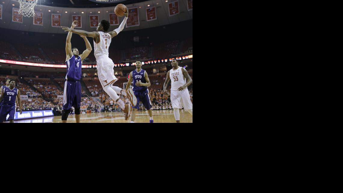 
Texas’ Isaiah Taylor (1) drives to the basket over TCU’s Amric Fields (4) during the second half of an NCAA college basketball game, Wed., Feb. 11, 2015, in Austin, Texas. Texas won 66-43. (AP Photo/Eric Gay)
