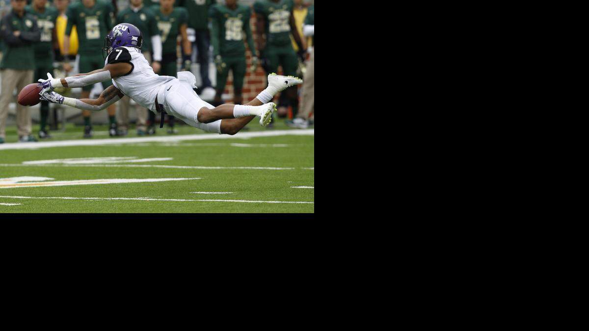 
TCU Horned Frogs wide receiver Kolby Listenbee tries to catch a pass in the first quarter against the Baylor. The Horned Frogs finished sixth in the final College Football Playoff rankings, one spot below the Bears. (Star-Telegram/ Richard W. Rodriguez)

