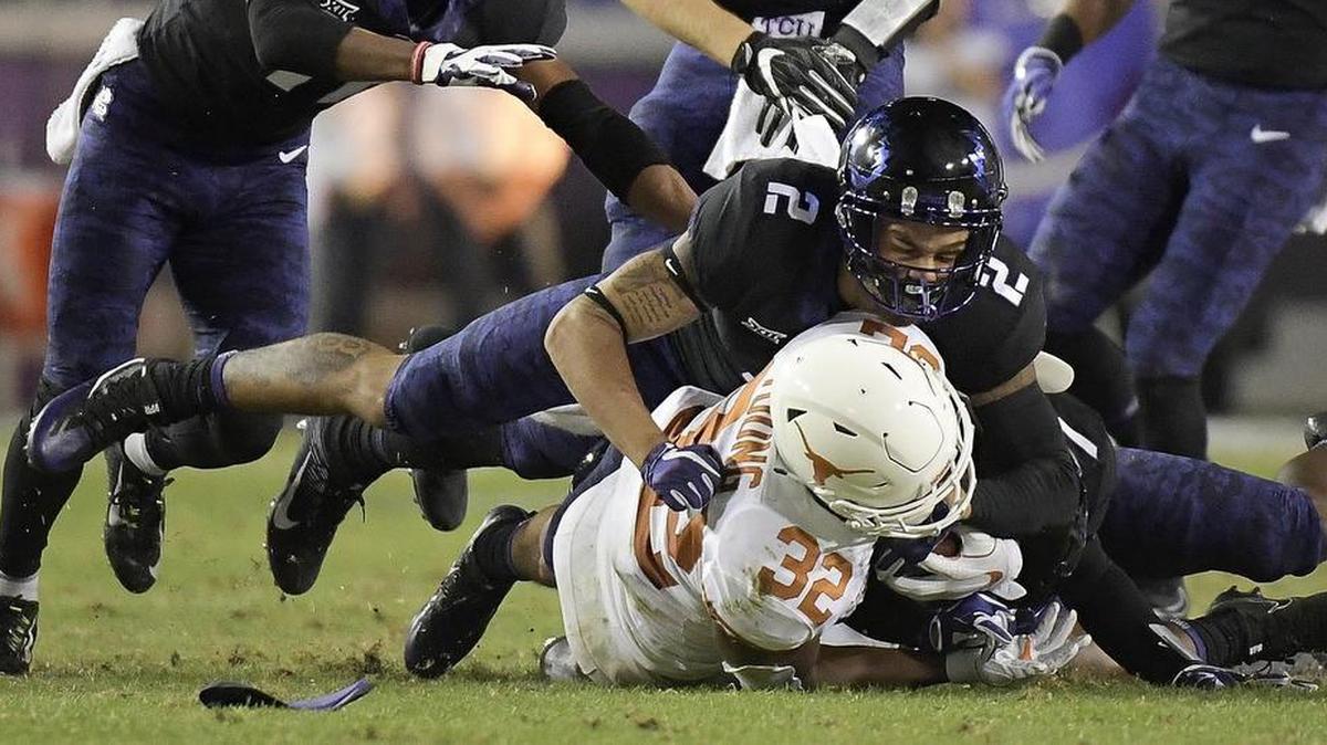 TCU safety Niko Small brings down Texas running back Daniel Young during a Nov. 4 game at Amon G. Carter Stadium. The Horned Frogs surrendered only 9 rushing yards in the 24-7 victory.