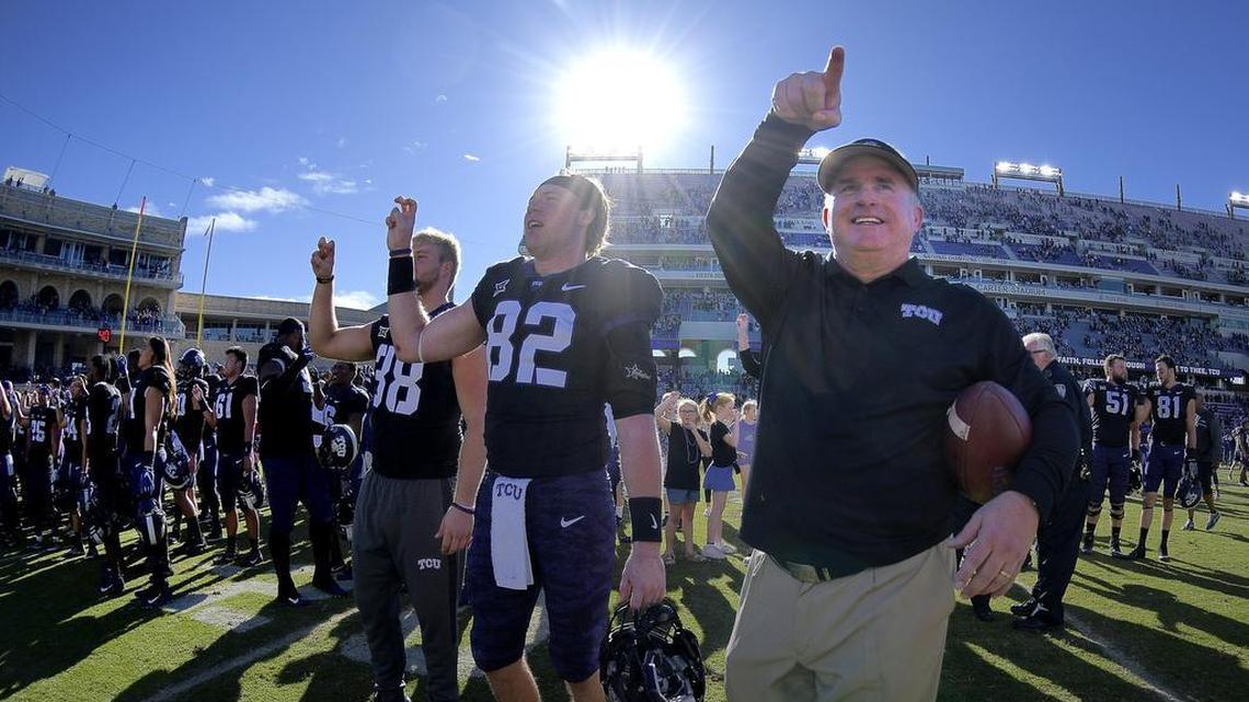 TCU coach Gary Patterson and players point to the student section in a celebration following a 45-22 victory against Baylor on Nov. 24 at Amon G. Carter Stadium.
