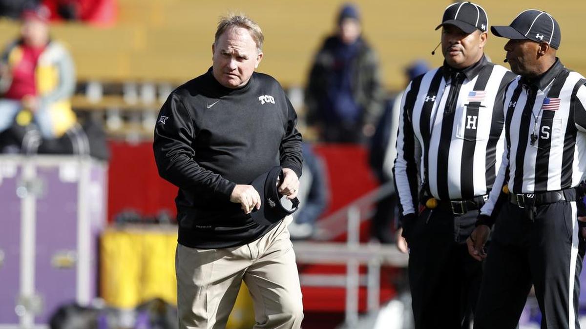 TCU coach Gary Patterson walks on the field near game officials before the start of last week’s Big 12 contest against Iowa State.