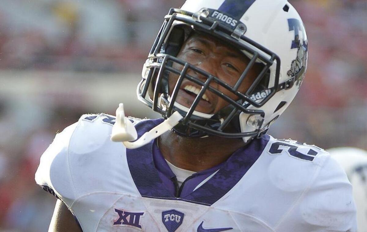 
TCU running back Aaron Green comes up all smiles after a 7-yard touchdown run in the third quarter against Texas Tech. A short while later, he would catch the game-winning pass off a tip in the Horned Frogs’ 55-52 win.
