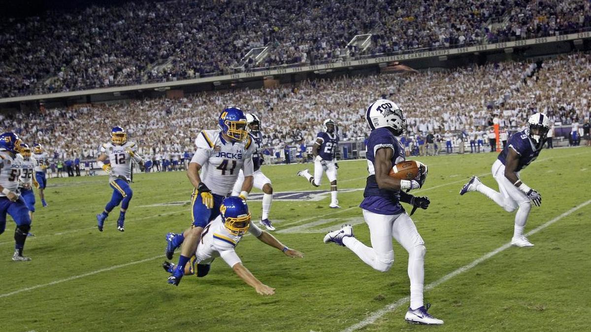 TCU’s KaVontae Turpin outruns South Dakota State defenders on an 81-yard punt return for a touchdown.