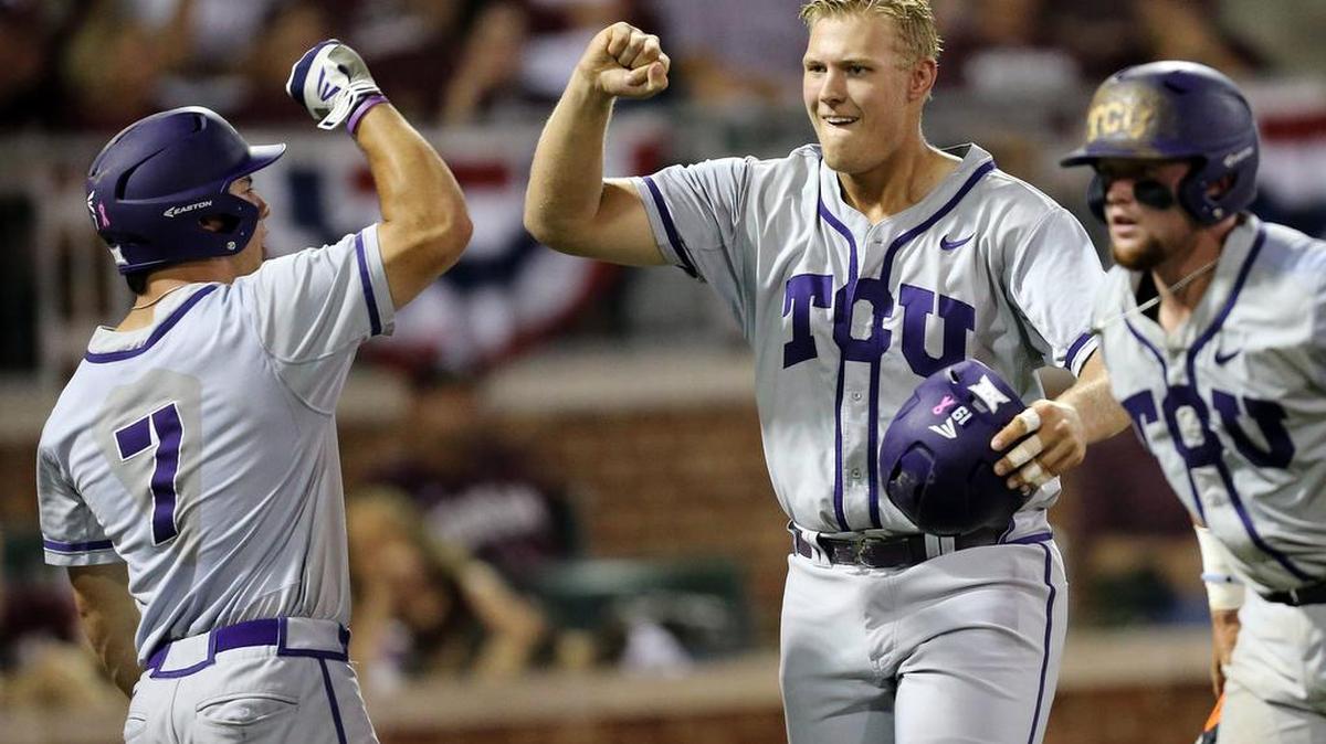 TCU designated hitter Luken Baker gets congratulations from Josh Watson after a three-run home run in the third inning in Game 1 of a Super Regional against Texas A&M on Friday in College Station. It was his fifth home run in nine games since the end of the regular season.