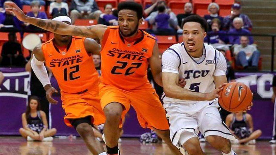 
TCU guard Kyan Anderson, right, helped led the Horned Frogs’ charge with 14 points Saturday against Oklahoma State. 
