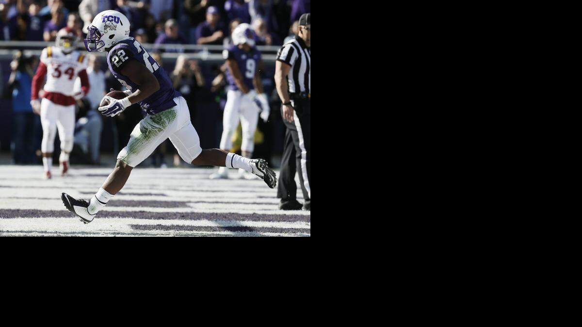 
TCU running back Aaron Green scores a touchdown during the first half. (AP Photo/Brandon Wade)
